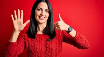 Young,Brunette,Woman,With,Blue,Eyes,Wearing,Casual,Sweater,Over