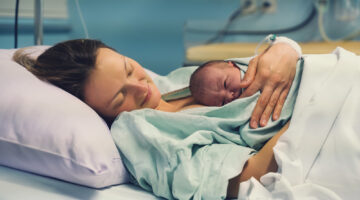 Mother,And,Newborn.,Child,Birth,In,Maternity,Hospital.,Young,Mom