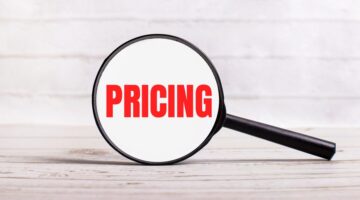 The,Magnifying,Glass,Stands,Vertically,On,A,Light,Background,With