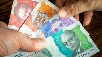 Colombian,Money,,Lots,Of,Pesos,Banknotes,Handed,Over,To,Another