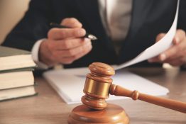 Man,Hand,Wooden,Judge,With,Document