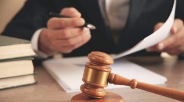 Man,Hand,Wooden,Judge,With,Document