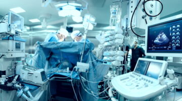In,Advanced,Operating,Room,With,Lots,Of,Equipment,,Patient,And