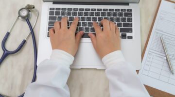 top-view-doctor-working-with-laptop-2